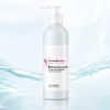 Flacone IdraCare Cream 250 ml su sfondo azzurrino con effetto acqua, per richiamare idratazione e freschezza.