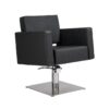 Poltrona da taglio professionale modello FLIRTY con seduta in schiuma ad alta densità, base quadrata in acciaio inossidabile e rivestimento nero resistente.