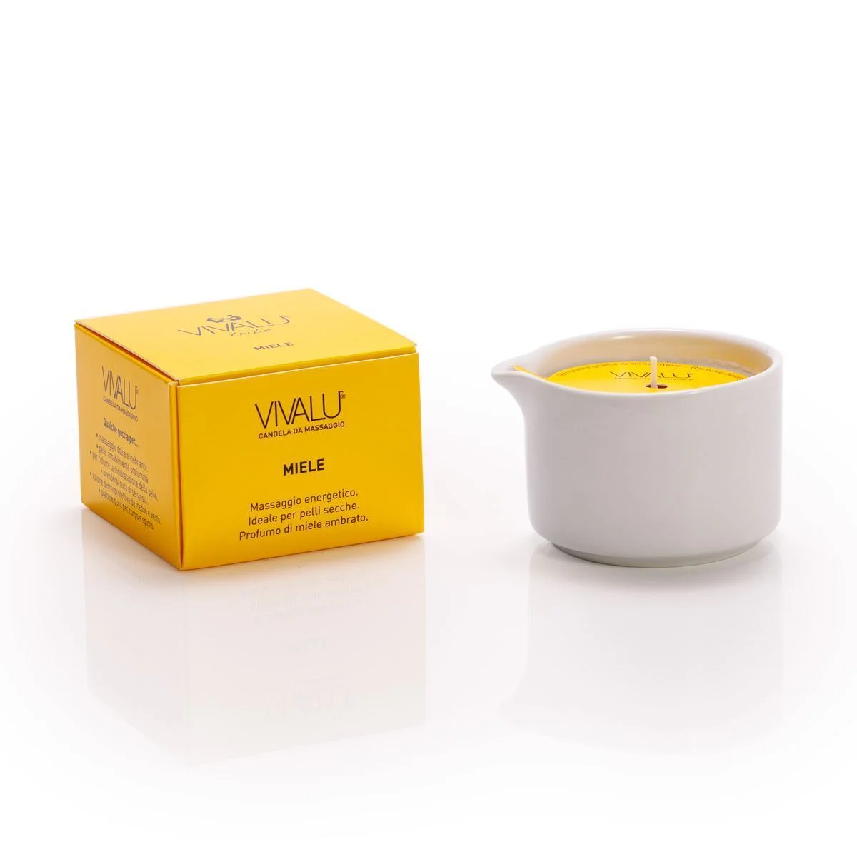 Candela da massaggio al miele Vivalu in contenitore bianco con scatola gialla accanto.