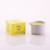 Candela da massaggio ai vinaccioli d'uva Vivalu in contenitore bianco con scatola gialla accanto.