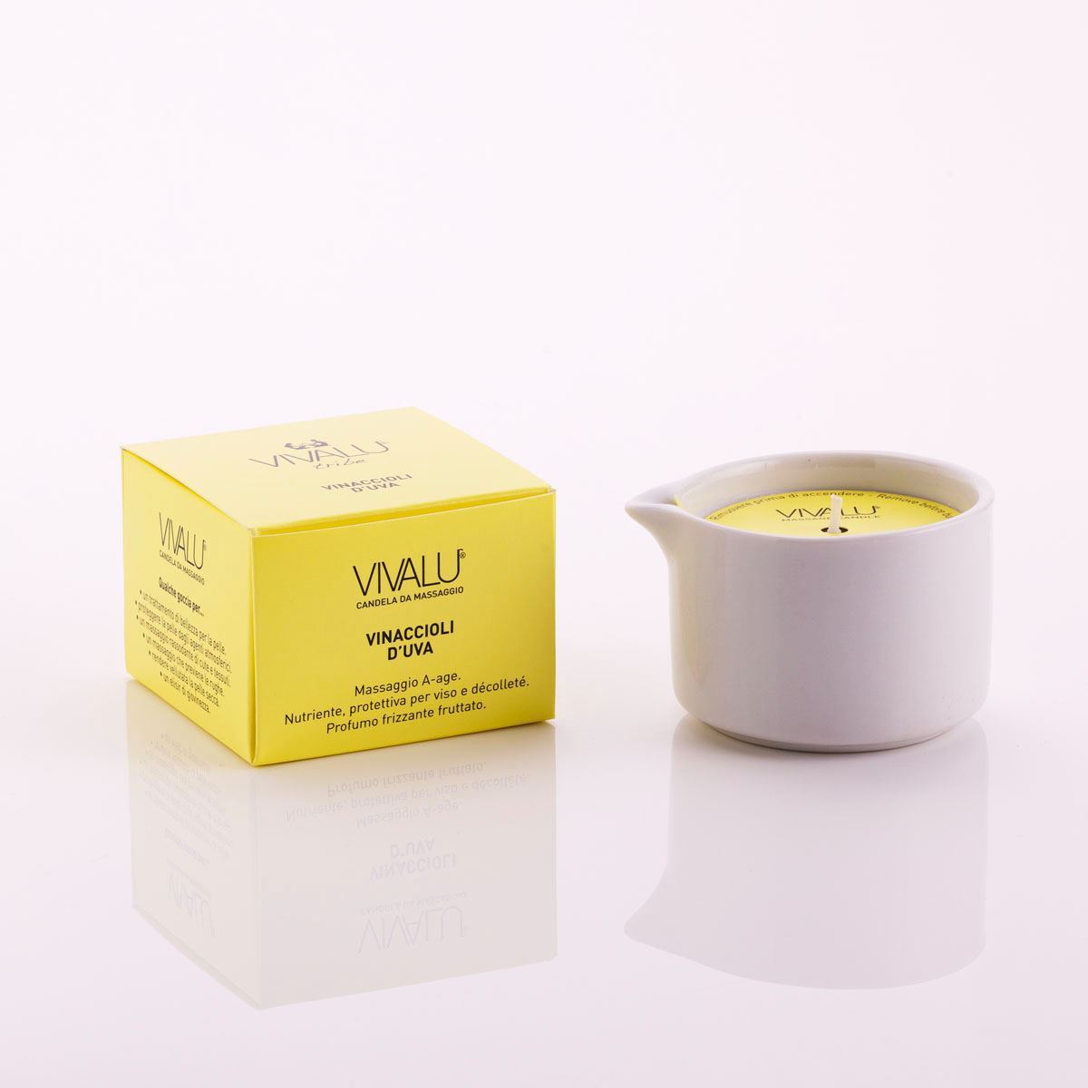Candela da massaggio ai vinaccioli d'uva Vivalu in contenitore bianco con scatola gialla accanto.
